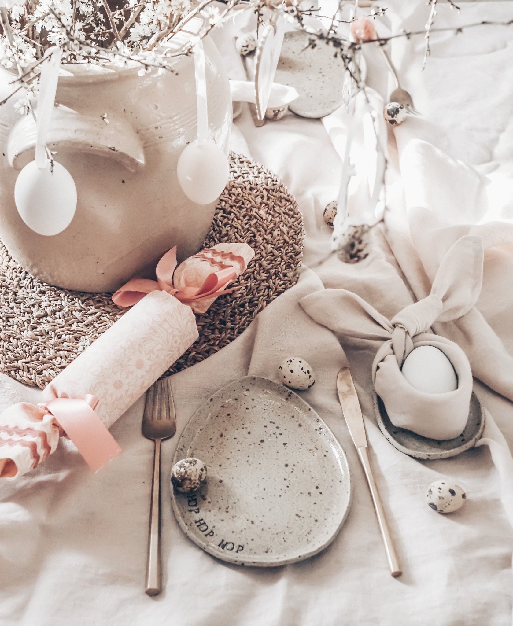 laid Easter table, with a knife and fork laid either side of an egg shaped plate